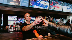 Bartender serving a pint at Chickie's & Pete's, SAHARA Las Vegas.