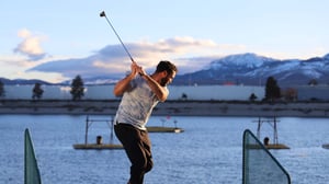 Photo of Guest swinging a golf club at Grand Bay Driving Range at Grand Sierra Resort in Reno, Nevada